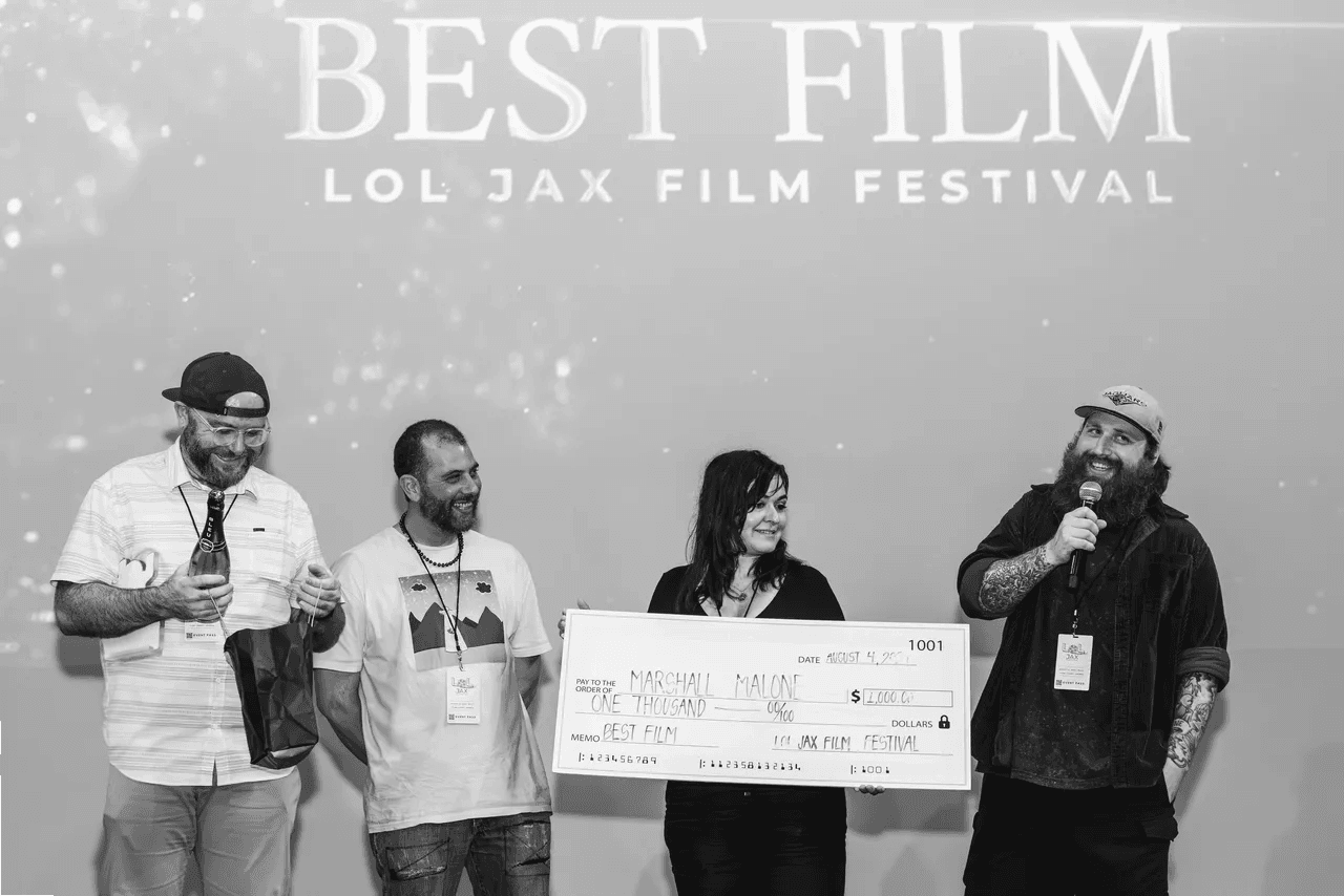 The Weight team accepting Best Film at LOL JAX in 2024
